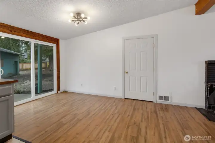 Eating area right next to kitchen. Room for a large table