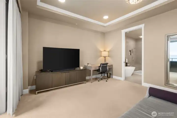 Angled shot of the entry into the private primary bath. to the left of the photo is another access onto the deck. Great to open the doors for fresh air in the evenings.