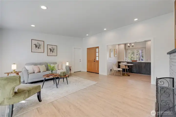 Living room, dining room, showing garage door on the left