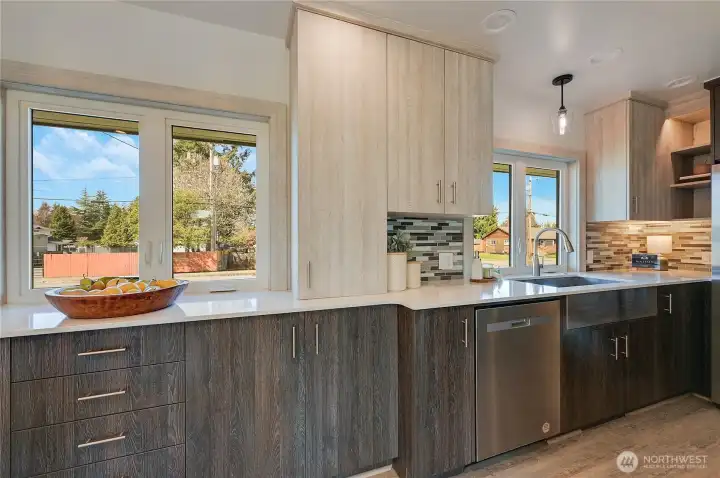 Custom cabinets continue to the dining room for more storage space bank of 4 drawers is really a nice feature