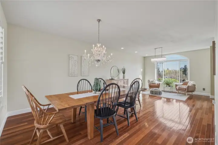 Formal dining room with gorgeous chandelier and adjacent to the formal living room for easy entertaining.