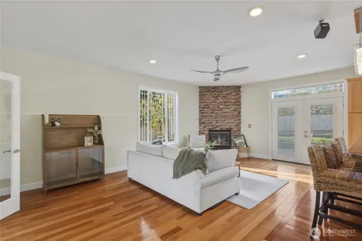 Beautiful rocked fireplace to keep you cozy in winter months. The executive office or bonus room is located behind the family room where you see one of the French doors.