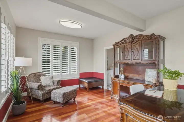 The laundry room and guest bathroom are located towards the back of the office.