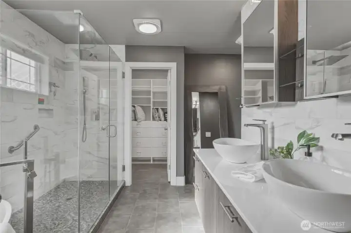 This bathroom is stunning and you must see it for yourself! Large walk-in closet located through the bathroom.