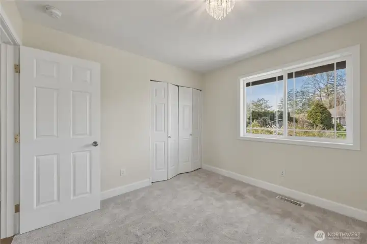 Guest bedroom #3 is located nearest to the primary suite and also faces the backyard.