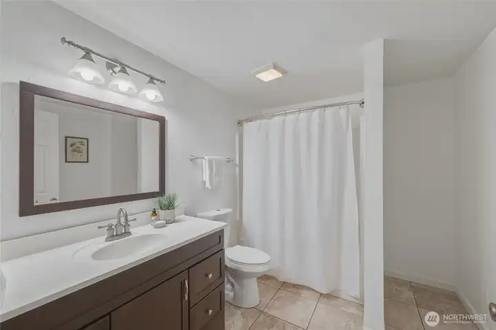 Lower level bathroom with shower/bathtub combo