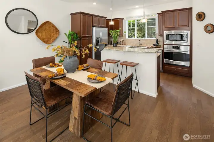Bright, open-concept kitchen with abundant cabinetry, stainless steel appliances, and ideal entertaining flow