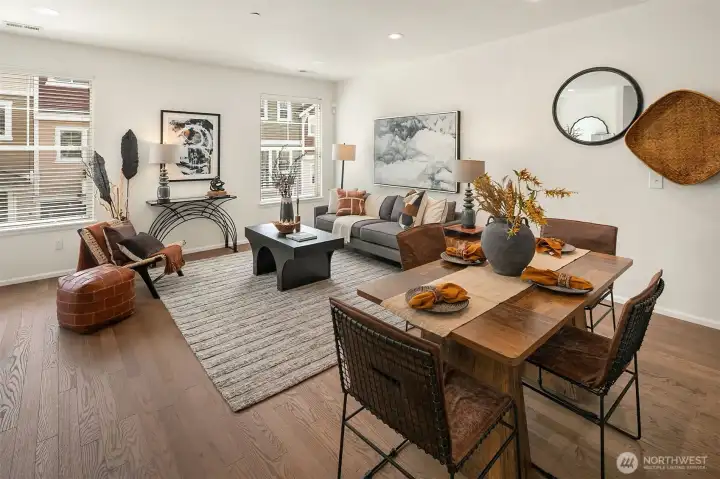 Inviting main living area with oversized windows an warm, comfortable design