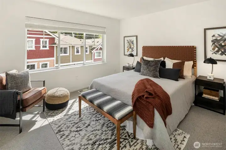 large primary bedroom with ample space for entertainment