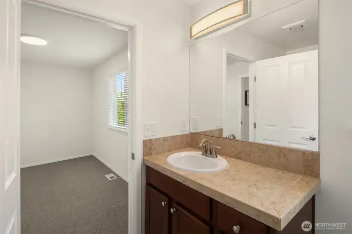 En-suite bathroom with large walk in closet