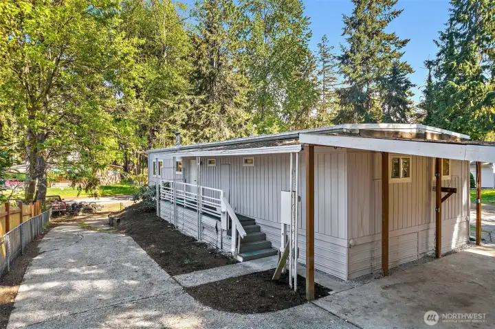 View from back yard.  Stairs lead to door in kitchen.