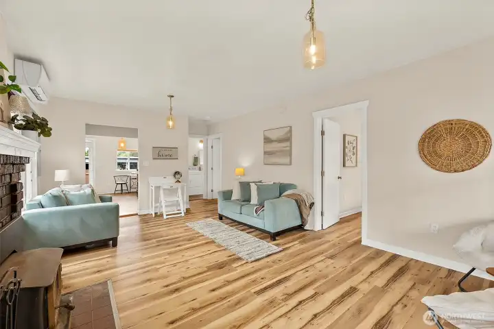Spacious open-concept living area with modern updates, warm finishes, and flexible layout for everyday living and entertaining.