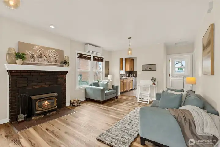 Comfortable living room flows seamlessly toward the kitchen and dining areas, offering an ideal setup for entertaining and daily living.