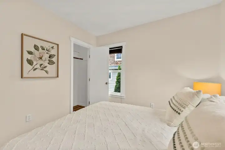 Comfortable Primary bedroom includes closet storage, neutral finishes, and plenty of natural light.