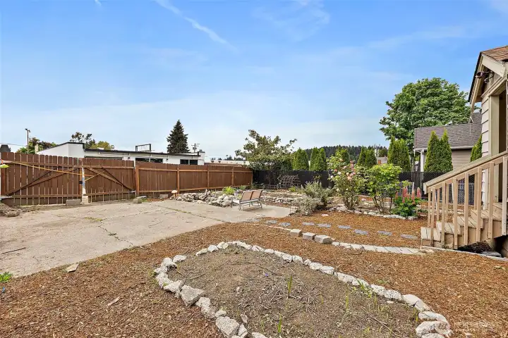 Generous backyard provides alley access, patio space, and room for gardening, recreation, or additional parking possibilities.