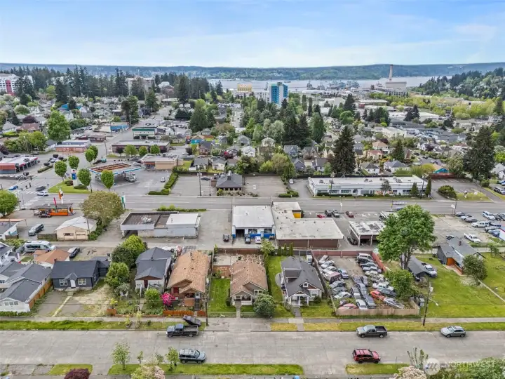 Centrally located near PSNS, Seattle ferry access, shopping, dining, and downtown Bremerton amenities with water and mountain views nearby.