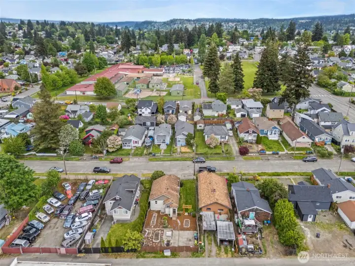 Neighborhood aerial highlights convenient proximity to schools, parks, and local amenities in the heart of Bremerton.