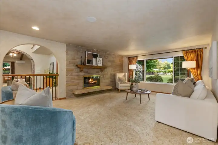 Cozy living room with wood burning fireplace.