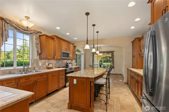 Spacius kitchen with abundant cabinet space.