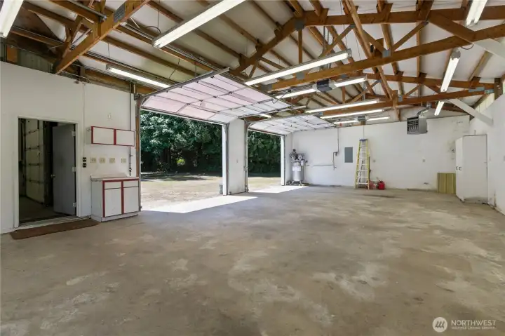 Outbuilding 1: Additional garage space with space for up to 4 cars.