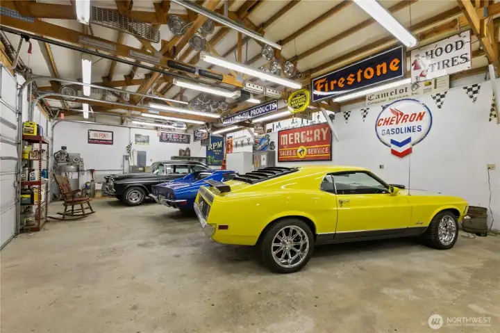 Outbuilding 1: Additional garage space with space for up to 4 cars. (Photographed before sellers moved out)
