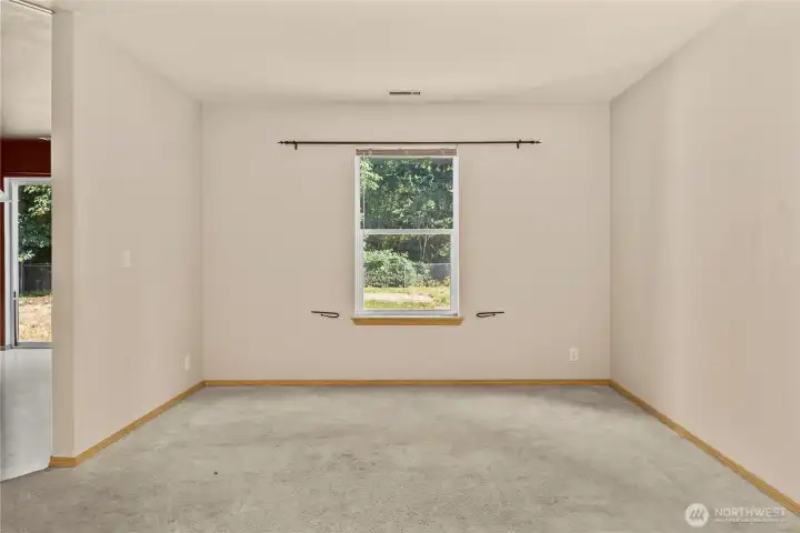 Located at the end of the living room, this dining area will hold an entertainment sized table.