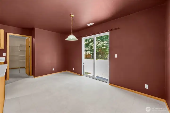 The laundry & storage room is located off the kitchen w/ a pass-thru to the garage.