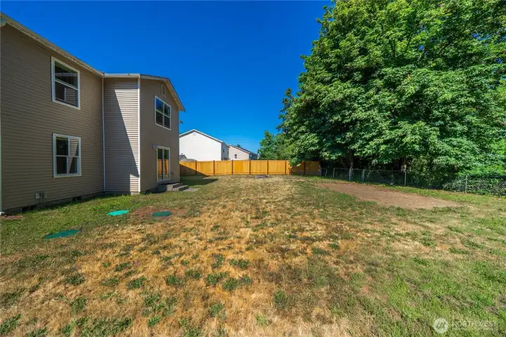 Fully-fenced backyard offers room for a pool, gardening, play space - whatever you need.