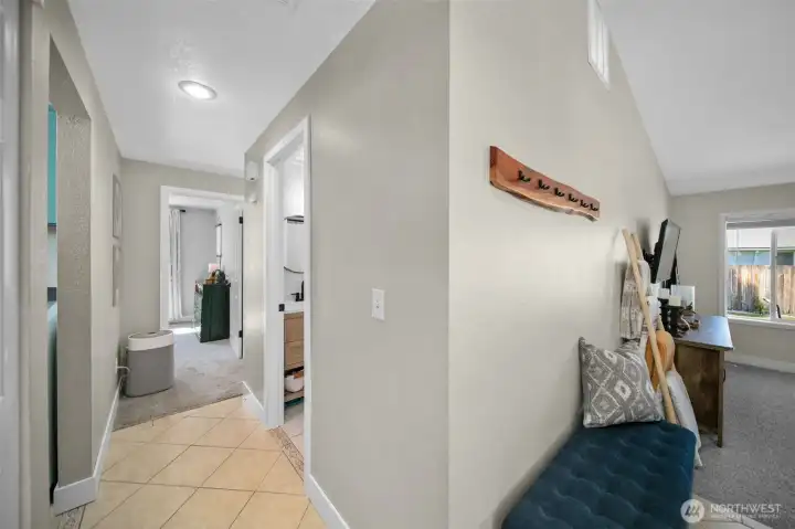 Hallway to laundry room, bath and bedrooms.