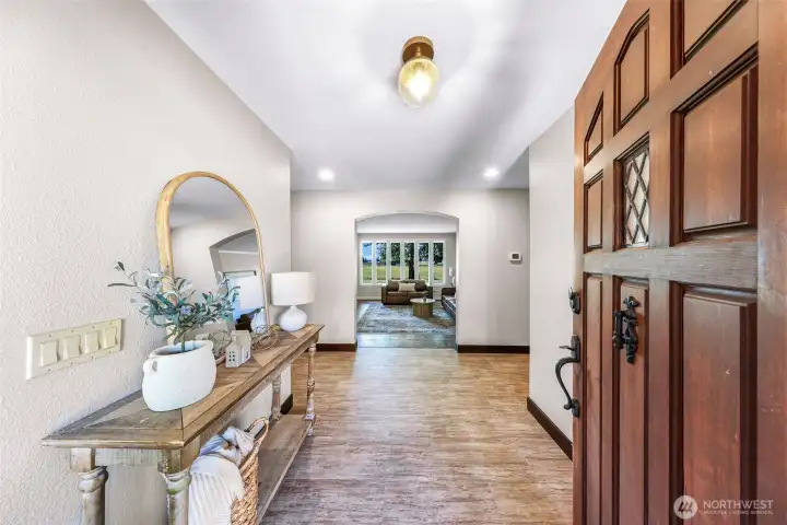 Entryway into the foyer and living room featuring a wall of windows looking south.