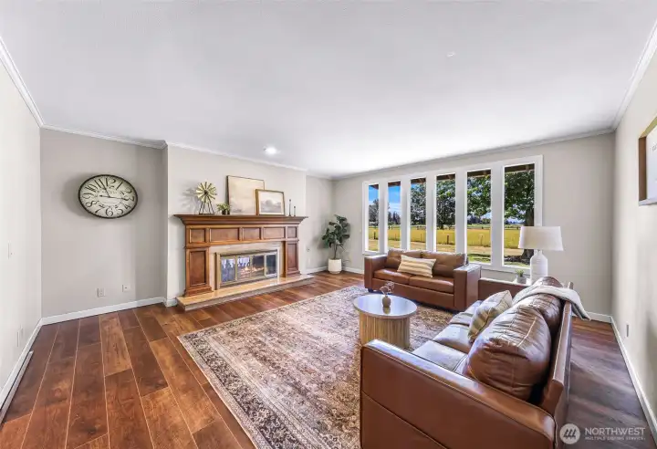 Another view of living room, new floors and fresh paint make this a wonderful place to visit with guests and to just relax.