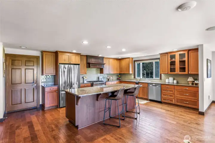 Another view of kitchen with eating bar.