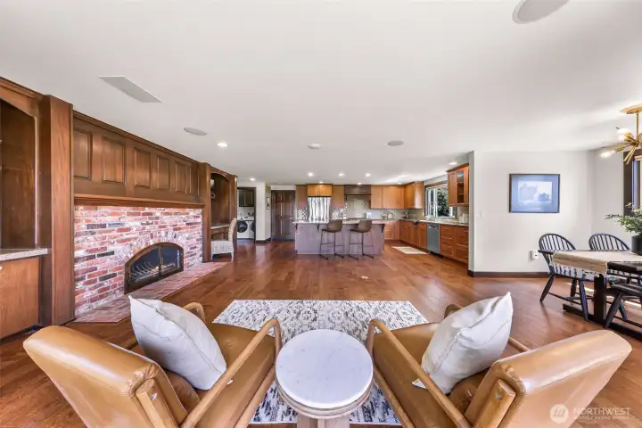 Family room with feature fireplace into kitchen.