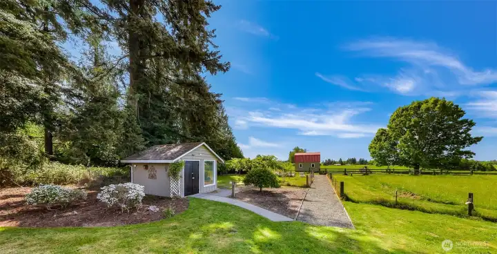 Potting shed and barn, garden area with raised beds, pasture for animals.