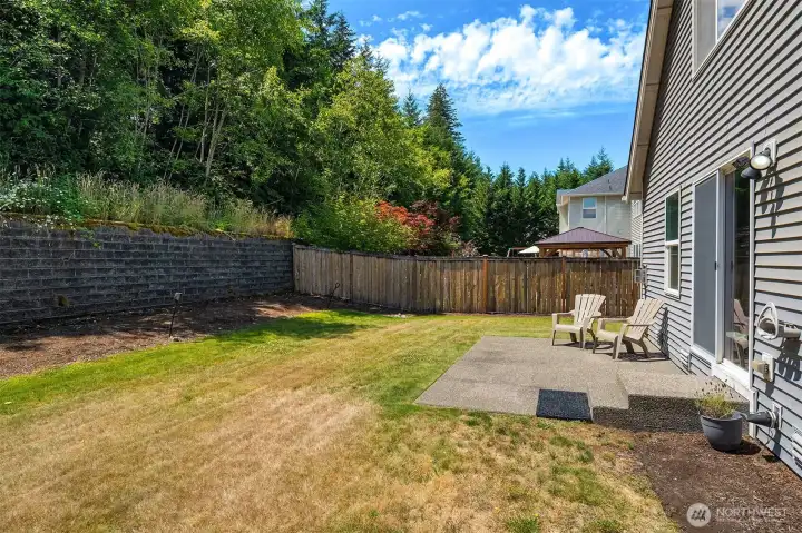Large fenced back yard with patio. Large fenced back yard with patio.