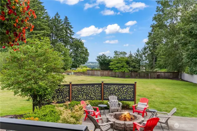 Outdoor patio has a view of the valley and overlooks the rest of the lawn area.