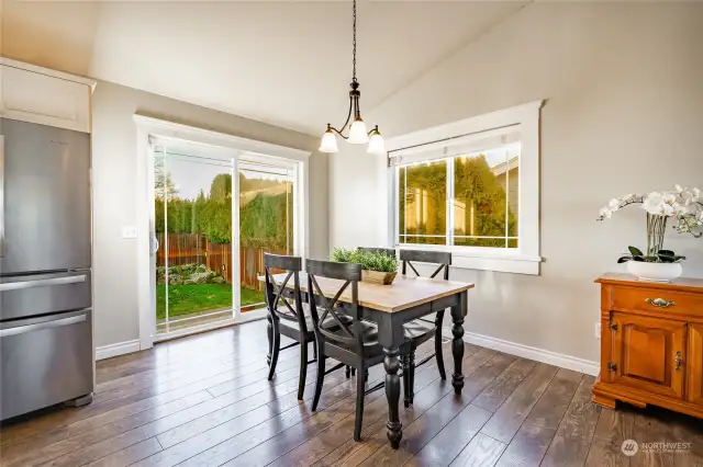 Dining with ample natural light and access to back patio.