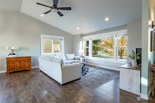 Light and bright living room with vaulted ceilings, new paint and durable lamimate floors