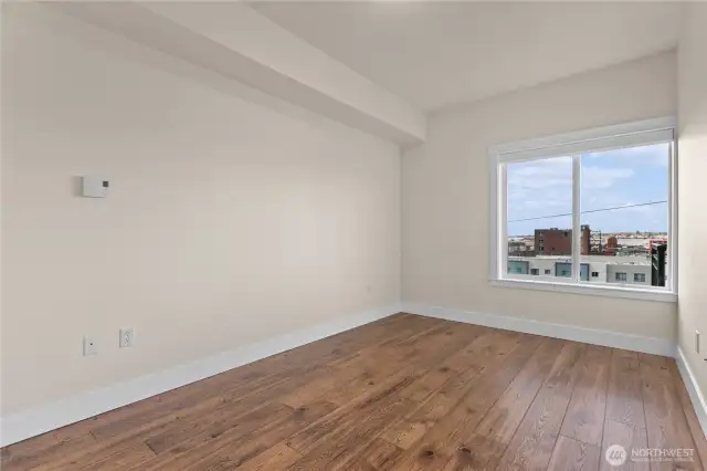 Large bedroom suite with view window & auto blinds