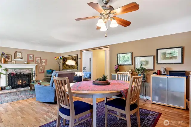 Enter into main living area - original hardwood floors and gas fireplace.