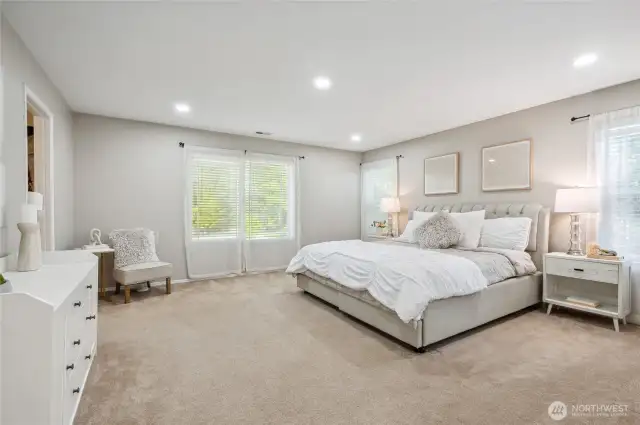 Escape to the spacious primary suite with a walk-in closet.