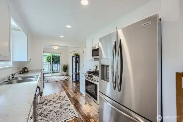 Upgraded french door refrigerator with ice maker. Notice all the cabinet & counter space this kitchen brings!