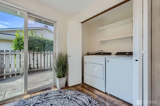 Conveniently located off kitchen, washer & dryer with shelving. Garage access door is between this area & the Kitchen