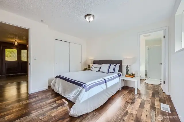 Primary bedroom with 3/4 bath overlooks the back yard