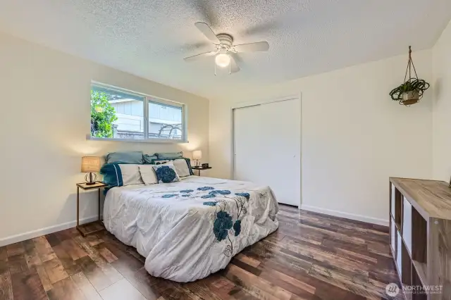 Another large bedroom, with ceiling fan. Bedroom closets are decent sized with built-in shelving