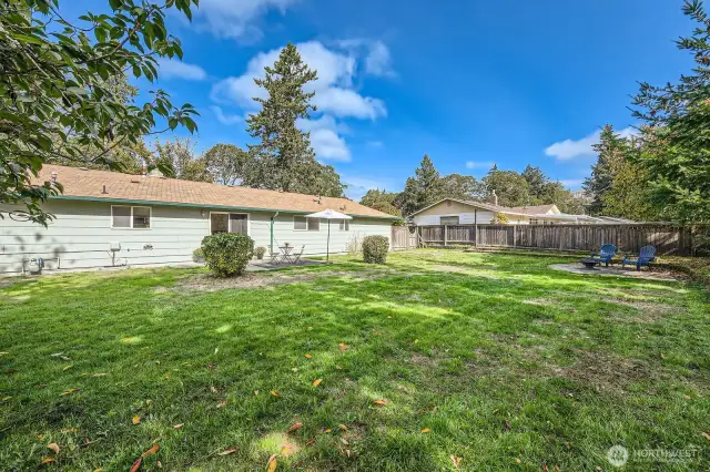 Massive grassy yard is sure to be a favorite attribute of this property