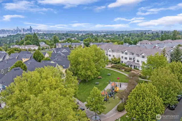 Drone view over the community shows Viewpoint park pond and the close proximity, only 6.5 miles to downtown Seattle. High Point is a sub-neighborhood in West Seattle, within the city of Seattle.