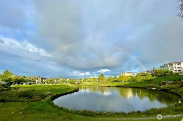 Incredible views! The homeowner took this full rainbow photo while walking around the pond just steps away from the home (shown in the upper righthand corner of this photo).