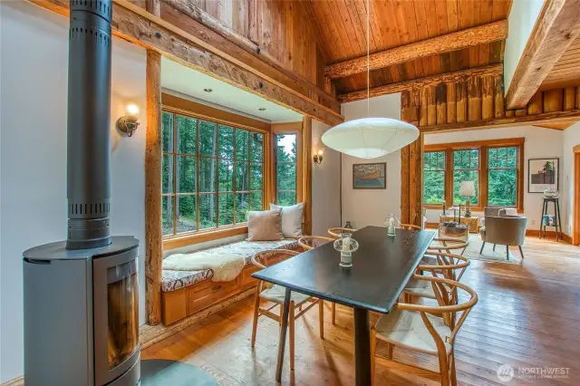 A two-story vaulted ceiling creates a dramatic setting for the dining area.