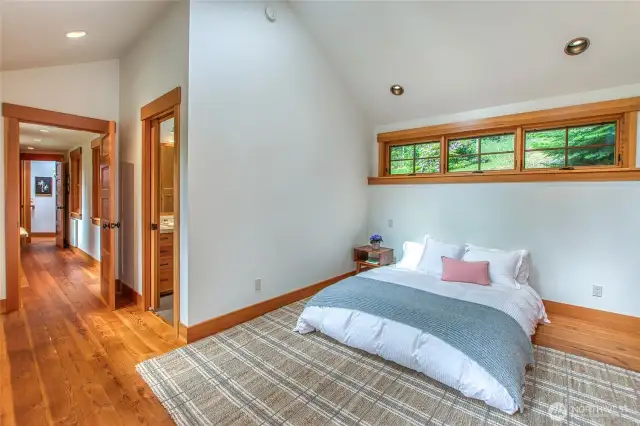 The primary ensuite is separated by a long hallway/office area.